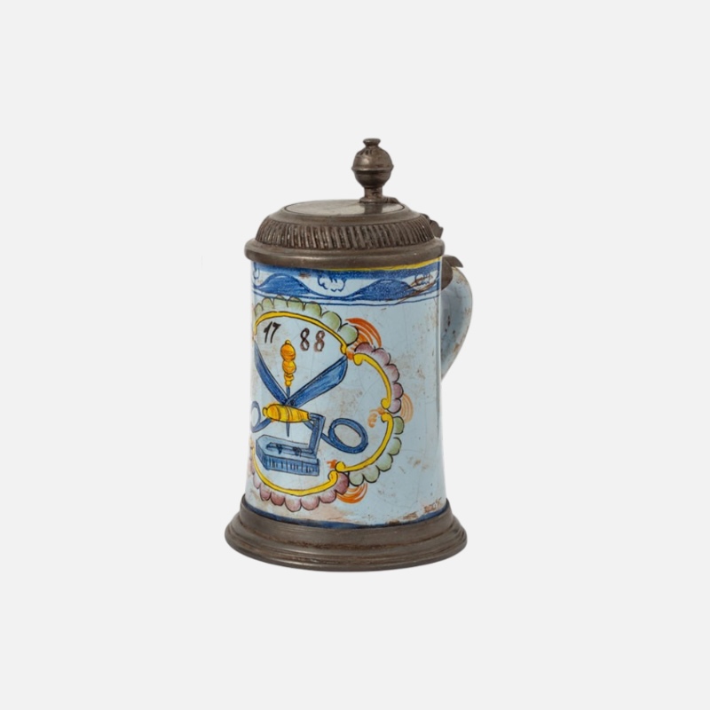 Hand-decorated old pewter mugs
