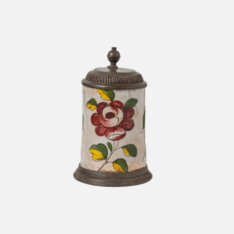Hand-decorated old pewter mugs
