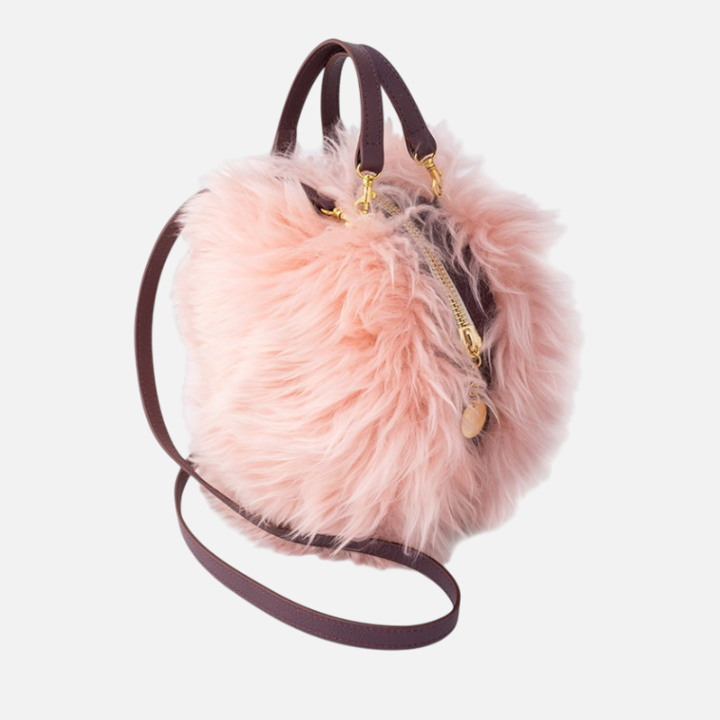 Borsa rotonda in pelle e pelo di pecora rosa