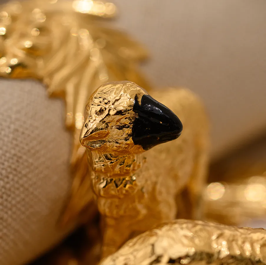 Elegant pair of high quality hand-painted gilded pewter napkin rings