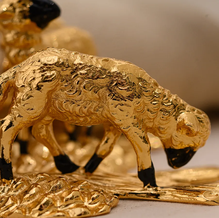 Elegant pair of high quality hand-painted gilded pewter napkin rings