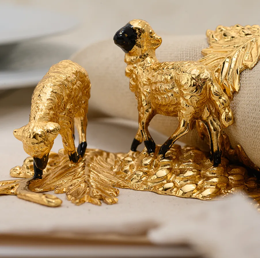 Elegant pair of high quality hand-painted gilded pewter napkin rings